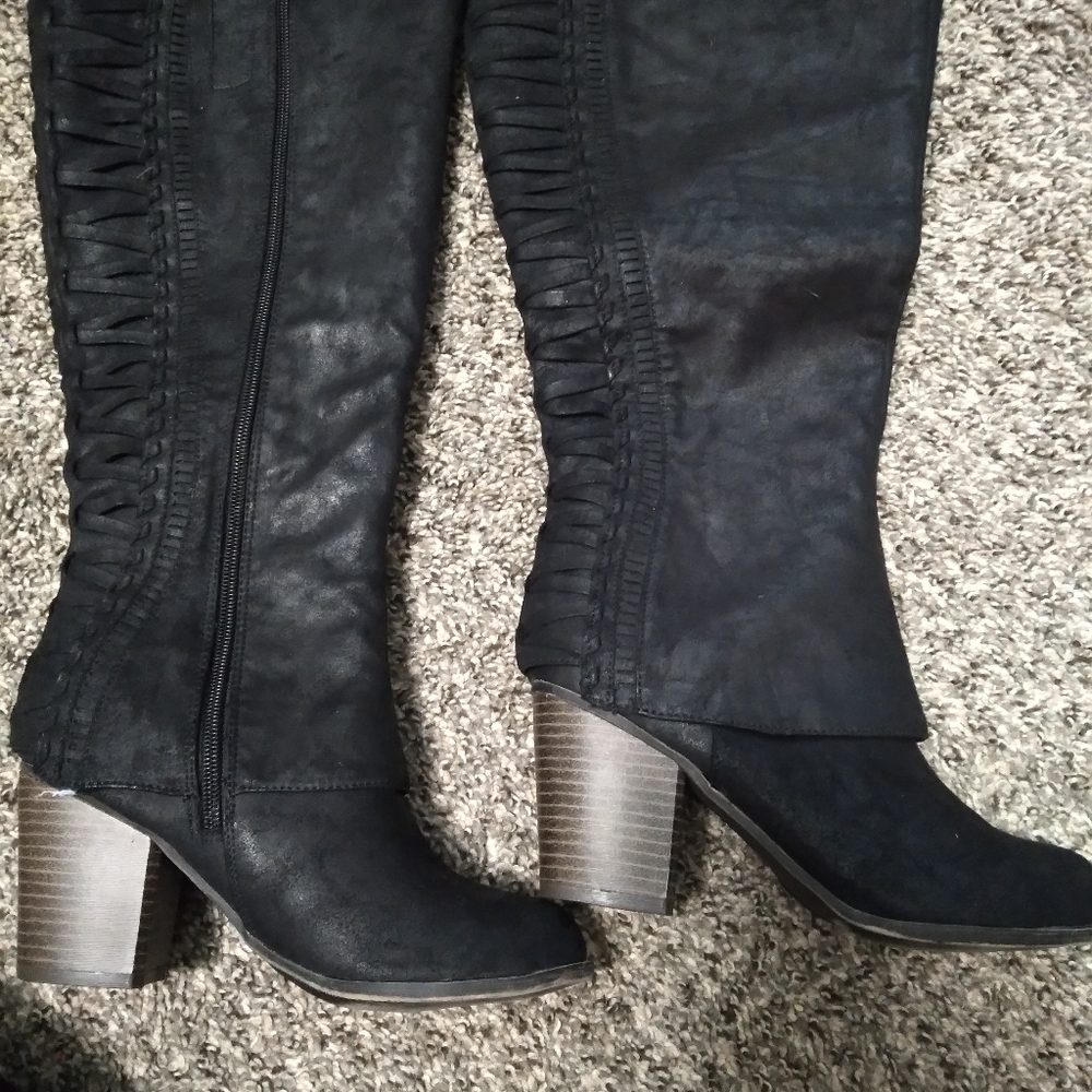 Knee high heeled boots
